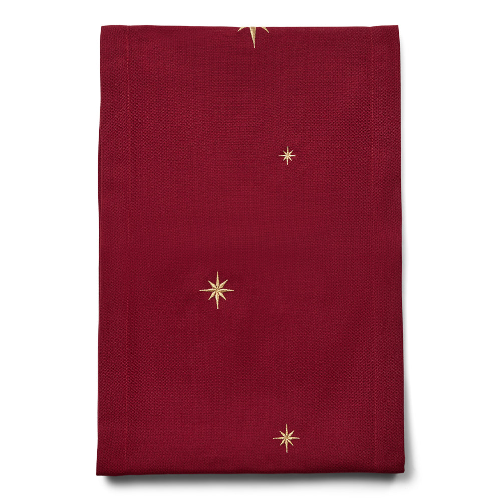 Mørkerød bordløper med gullstjerner
